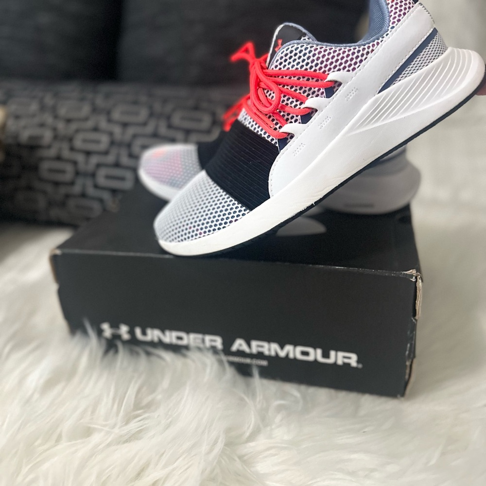 Under armor red black and pink running shoes.